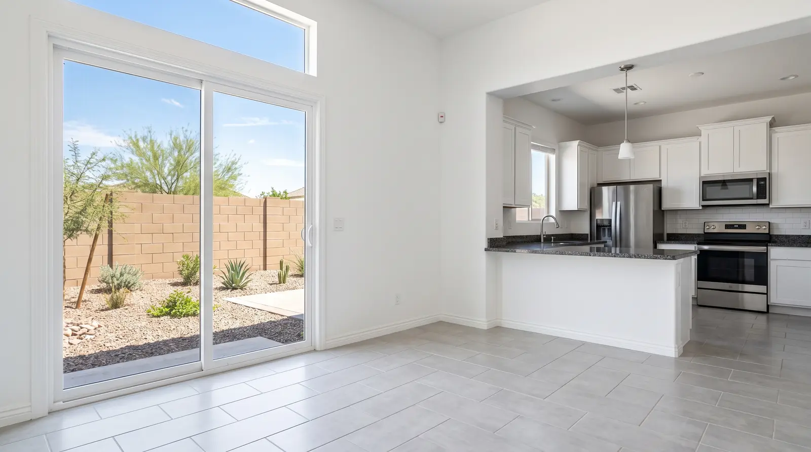 Vacant, freshly cleaned dining area and kitchen pass-through in a Queen Creek, Arizona rental home